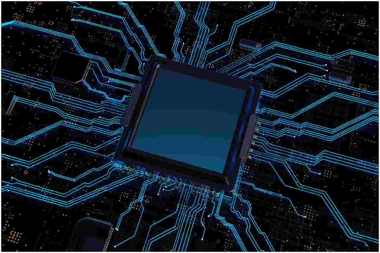 Technology concept with a glowing blue computer chip processor on a motherboard.